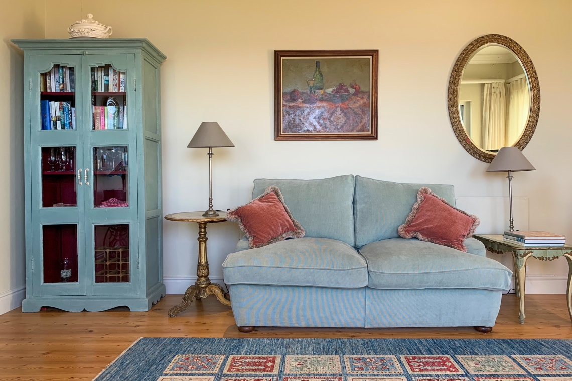 Comfortable living area with books for reading. Holiday accommodation in Kalk Bay. The Kalk Bay Portfolio