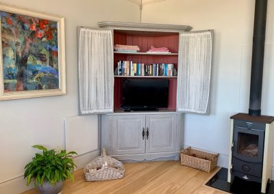 TV and Fireplace - Holiday accommodation in Kalk Bay.