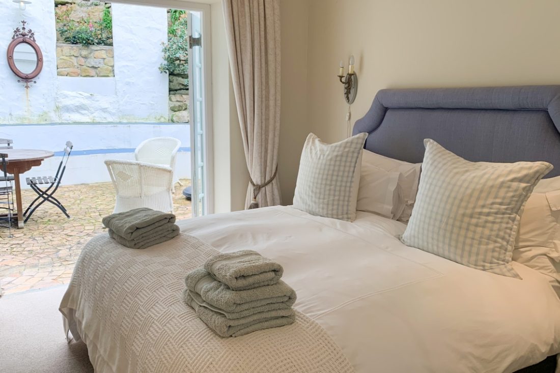 Bedroom opening onto the patio - Holiday accommodation in Kalk Bay.