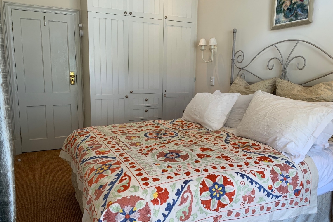 Indian linen and Turkish bedcover. Holiday accommodation in Kalk Bay. The Kalk Bay Portfolio